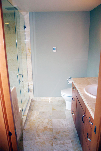 Renovataed a master bathroom installing marble tile, heated floor, and a Japanese soaking tub