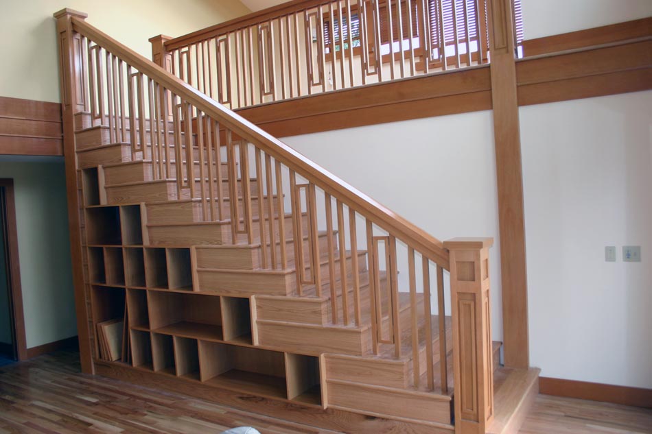 Handcrafted stairs, shelves, and railing built to access the new loft