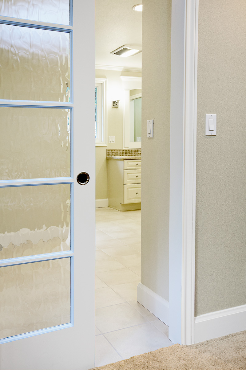 Adding a recessed pocket door created separation between master bath and master suite areas
