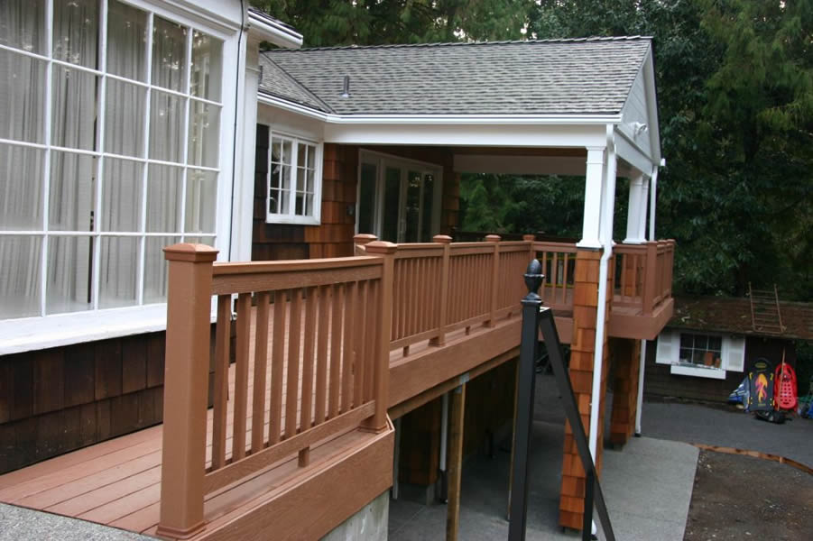 After, removed existing sunroom and built a dual entry deck and covered entertaining space