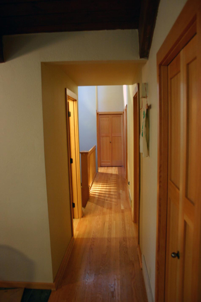 Renovated hallway leading to the new stairwell and basement