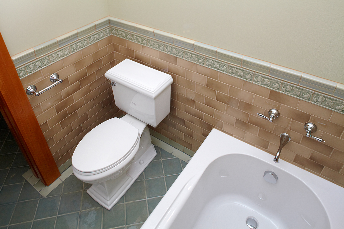 We added a bathroom to floor plan with custom tile and fixtures to match era of home